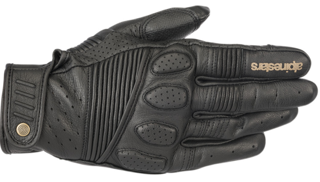 A single black leather motorcycle glove with perforated and ribbed details, featuring the Alpinestars logo in gold on the back of the hand, shown against a plain white background.