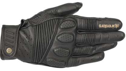 A single black leather motorcycle glove with perforated and ribbed details, featuring the Alpinestars logo in gold on the back of the hand, shown against a plain white background.